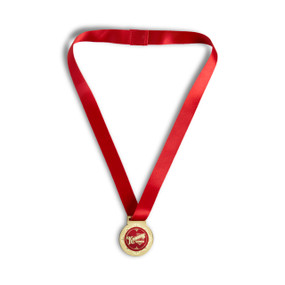 A gold and red medal on a red ribbon that says "Kindness Award".