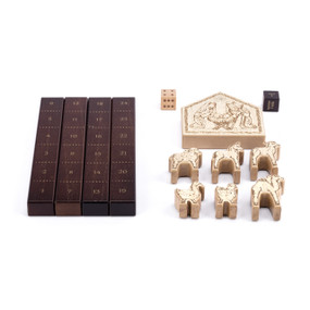 A wood nativity animal race game with dark wood number boards, animal pieces, a stable and dice.