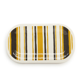 Top down view of a large white rectangular melamine platter with vertical stripes in brown and mustard yellow.