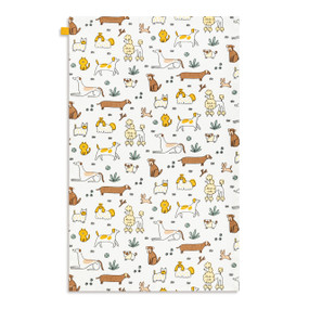 A white kitchen towel with illustrated cartoon dogs, displayed laid out flat.
