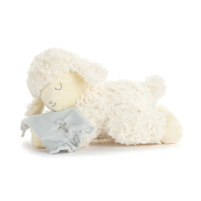 A cream plush mechanical lamb laying down with a light blue blanket.