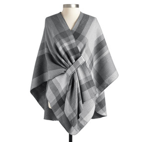 A gray plaid reversible wrap displayed on a mannequin.