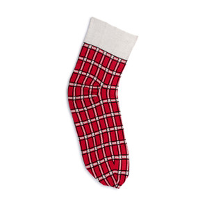 A red and black plaid wearable blanket in the shape of a stocking with a wide band of white at the top.