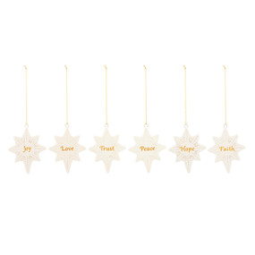 Six different white star of Bethlehem ornaments each with a different word on them.