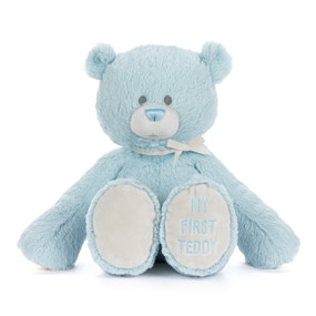 A light blue plush bear with "My First Teddy" embroidered on the paw of his left leg.