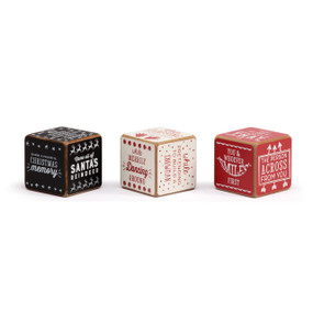 A set of three wood dice painted red, white and black. Each dice has different instructions that when read together create a fun holiday activity.