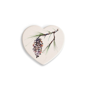 A set of four heart shaped white ceramic coasters with a watercolor image of a white pine branch.