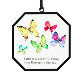 A hexagon shaped suncatcher with watercolor butterflies and the saying "Faith is a beautiful thing that flutters in the soul".