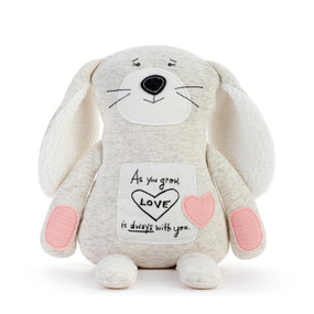A plush bunny made of heather fabric with a fabric patch on its belly that says "As you grow Love is always with you". The bunny has pink paws and a pink heart on its belly.