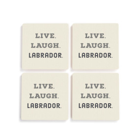 A set of four white ceramic coasters with the saying "Live. Laugh. Labrador."