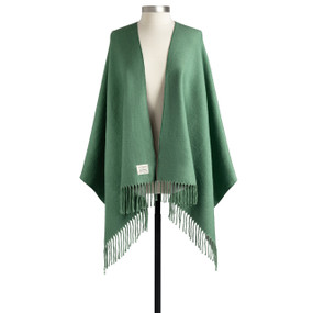 A green fringed wrap displayed on a mannequin.