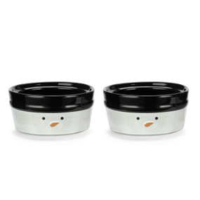 Two white ceramic ramekins with a snowman's face on the front and a black rim and interior, displayed angled to show the lip on the inside.