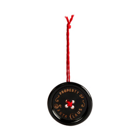 A round black button ornament on a red string that says "Property of Santa Claus".