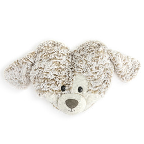 A heart shaped weighted pillow with the face and ears of a puppy. The pillow is plush gray with heather fabric for the ears and face.