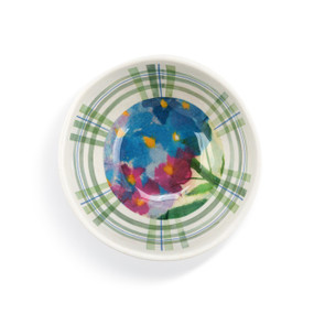 Top down view of a white and green dip bowl with a blue and pink hydrangea pattern on the inside.