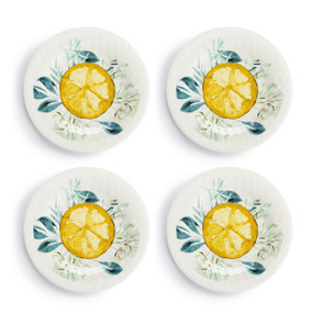 A set of four white melamine appetizer plates with a lemon pattern in the middle, displayed set out next to each other.