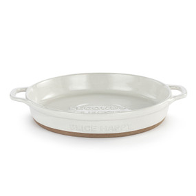 A round white ceramic pie dish with a tan textured base, handles on the sides and the saying "Slice Happy" on the side.