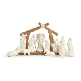 A set of eleven cream figures representing the Nativity scene. There is also a wood centerpiece for the barn and star.