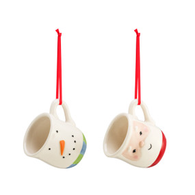 A set of two coffee pod ornaments. One is a snowman with a red and green scarf, one is a Santa face with a red base. Each with a red string.