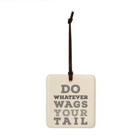 A square cream hanging tile magnet ornament with the saying "Do whatever wags your tail".