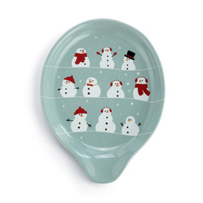Top down view of a light blue green ceramic spoon rest with three rows of different snowmen.