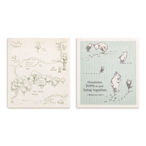 Two biodegradable dish cloths in cream and light green. One has an image of the hundred acre wood and the other has Pooh and Piglet with the saying "Sometimes, love is just being together".