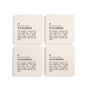 A set of four white ceramic coasters with the saying "RE: Out of Office Up in the Mountains" with a short write up about someone in the mountains.
