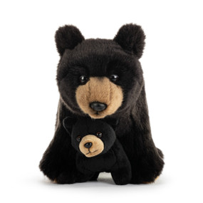 An adult plush standing black bear with a baby cub cuddled between its front paws.