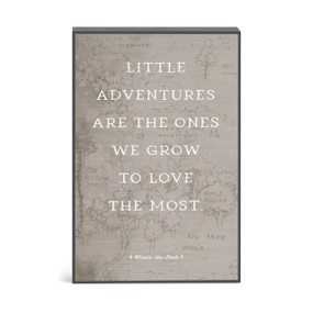 A gray wall art of the hundred acre woods with the saying "Little adventures are the ones we grow to love the most".