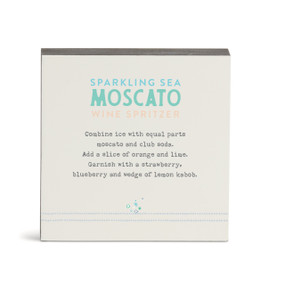 A white square wall art with a basic recipe for a Sparkling Sea Moscato written in green.