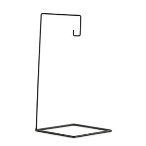 A black metal ornament stand with a square base that holds one ornament.