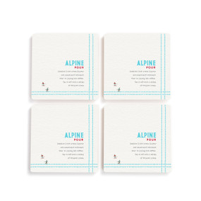 A set of four white square coasters with a basic recipe for an Alpine Pour written in blue.