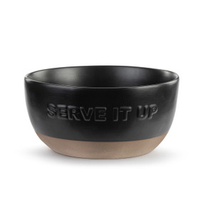 A black ceramic bowl with a tan textured base. The front of the bowl reads "Serve It Up".