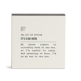 A white square wall art with the saying "RE: Out of Office It's 5:00 Here" with a short write up about someone leaving work for a bar.