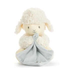 A sitting cream plush mechanical lamb holding a light blue blanket.