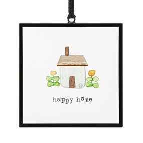 A small square suncatcher with a house and flowers made out of small colored stones and the saying "happy home".