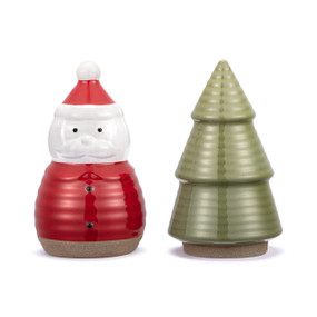 A set of salt and pepper shakers with one shaped like Santa Claus and the other shaped like an evergreen tree.