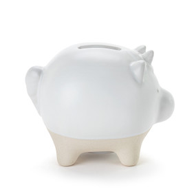 A white ceramic piggy bank with the face and horn of a unicorn. The feet of the bank are cream and textured.