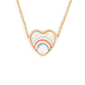Detail view of the charm on an adjustable gold chain necklace with a heart shaped charm of a rainbow.