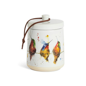 A white ceramic candle with watercolor hummingbirds on the outside and a removable lid.