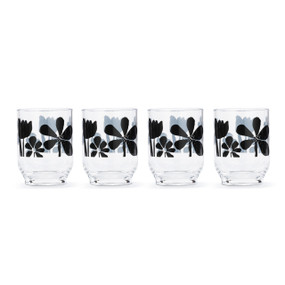 A set of four clear acrylic glasses with a bold black floral pattern.