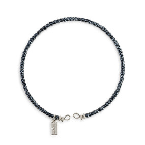 A round bracelet made of small gray beads.