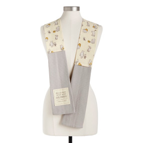 A light yellow Winnie-the-Pooh fabric kitchen boa with gray towel ends and a fabric patch with the saying "When in doubt, Just add honey", displayed on a mannequin.