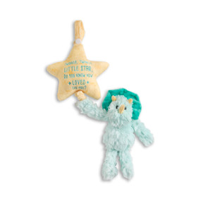 A green plush dinosaur hanging from a light orange plush star that says "Twinkle, Twinkle Little Star, Do You Know How Loved You Are?" in green.