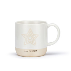 A white ceramic mug with a star shaped cream meditation path on the mug and a cream textured base that says "All Is Calm".