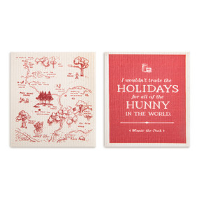 Two biodegradable dish cloths in red and white. One has an image of the hundred acre wood and the other says "I wouldn't trade the Holidays for all the Hunny in the world" on a red background.