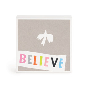 A small white box artwork of a white bird on a gray background and the word "Believe" in colorful letters.