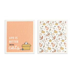 Two peach and white biodegradable dish cloths. One has illustrations of cats and the other is peach with a cat illustration and the saying "Life is better with cats".