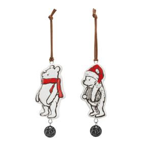 A set of two different Pooh ornaments with a metal charm at the bottom. One is wearing a red Santa hat the other is wearing a red scarf.