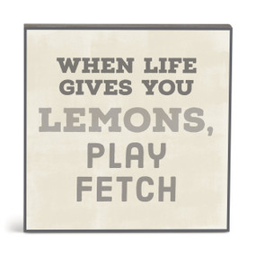 A square cream wall art with the saying "When life gives you lemons, play fetch".